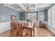 Elegant dining room boasting wainscoting, coffered ceilings and a chandelier, perfect for gatherings and entertaining at 1233 Dunn Creek Xing, Wake Forest, NC 27587