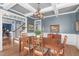 Elegant dining room boasting wainscoting, coffered ceilings and a chandelier, perfect for gatherings and entertaining at 1233 Dunn Creek Xing, Wake Forest, NC 27587