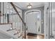 Inviting foyer with hardwood floors, staircase and traditional trim details, showcasing a bright and welcoming entryway at 1233 Dunn Creek Xing, Wake Forest, NC 27587