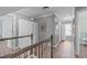 Bright hallway featuring hardwood floors, white cabinets, and natural light at 1233 Dunn Creek Xing, Wake Forest, NC 27587