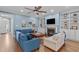 Cozy living room with a fireplace, built-in shelving, and comfortable seating arrangement, ideal for relaxation and gatherings at 1233 Dunn Creek Xing, Wake Forest, NC 27587
