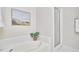 Bright bathroom featuring a soaking tub and glass shower at 200 S Dawson St # 303, Raleigh, NC 27601