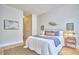 Bright bedroom with decor art and wood flooring at 200 S Dawson St # 303, Raleigh, NC 27601