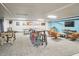 Recreation room featuring game tables, comfortable seating areas, and a wall-mounted television for entertainment at 200 S Dawson St # 303, Raleigh, NC 27601