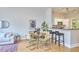 Inviting open-concept living space features dining area and adjacent modern kitchen, showcasing a seamless design at 200 S Dawson St # 303, Raleigh, NC 27601
