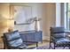 Stylish living room featuring modern decor, black leather chairs, and a sleek cabinet with decorative vase at 200 S Dawson St # 303, Raleigh, NC 27601