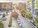 Street view of condo buildings with tree-lined sidewalks and parked cars at 200 S Dawson St # 303, Raleigh, NC 27601