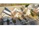 Charming townhomes with attached garages, surrounded by mature trees and landscaped yards at 209 Intern Way, Durham, NC 27713