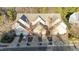 Charming townhomes with attached garages, surrounded by mature trees and landscaped yards at 209 Intern Way, Durham, NC 27713