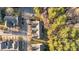 Aerial view of townhomes nestled among lush trees in a serene neighborhood at 209 Intern Way, Durham, NC 27713