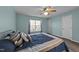 Spacious bedroom featuring a large window, ceiling fan, and plush bedding at 209 Intern Way, Durham, NC 27713