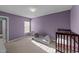 Charming bedroom with purple walls, natural light, and crib at 209 Intern Way, Durham, NC 27713