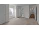 This bedroom has neutral carpet, white walls, and two doors at 209 Intern Way, Durham, NC 27713