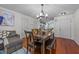 Dining room with wood table and chairs, open to the kitchen and living spaces at 209 Intern Way, Durham, NC 27713