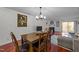 Inviting dining area with wooden table, chairs, and an adjacent living room at 209 Intern Way, Durham, NC 27713