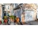 Home exterior with stone accents, siding, two car garage, and landscaped yard at 209 Intern Way, Durham, NC 27713