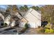 A well-maintained townhome with a two-car garage and landscaping at 209 Intern Way, Durham, NC 27713