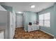 Cozy kitchen features white cabinets, stainless steel appliances, and a breakfast bar area at 209 Intern Way, Durham, NC 27713