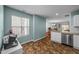 Eat-in kitchen area featuring stainless steel appliances, tile flooring, and a breakfast nook at 209 Intern Way, Durham, NC 27713
