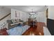 Open floor plan with dining area, sofa, and access to other rooms at 209 Intern Way, Durham, NC 27713