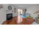 Inviting living room with a fireplace, sliding glass door and rich hardwood flooring at 209 Intern Way, Durham, NC 27713