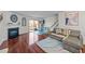Cozy living room featuring a fireplace, sliding glass doors, and wood flooring at 209 Intern Way, Durham, NC 27713