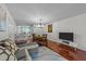 Bright living room with an open floor plan including the kitchen and dining area at 209 Intern Way, Durham, NC 27713
