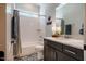 Charming bathroom with patterned tile, a marble countertop, white subway tile in shower and garden window above at 2109 Meadowcreek Dr, Durham, NC 27705