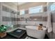 Stylish bathroom with a freestanding tub, glass-enclosed shower, and elegant tile work at 2109 Meadowcreek Dr, Durham, NC 27705
