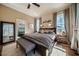 Bedroom showcases a decorative 'goodnight' sign, large windows, and ensuite bathroom entrance at 2109 Meadowcreek Dr, Durham, NC 27705