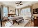 Bright bedroom with large windows, a ceiling fan, and a decorative 'goodnight' sign at 2109 Meadowcreek Dr, Durham, NC 27705