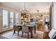 Well-lit dining room with an easy flow to the kitchen, creating a great space for entertaining at 2109 Meadowcreek Dr, Durham, NC 27705