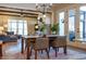 Open-concept dining room with hardwood floors and seamless flow to the living room area at 2109 Meadowcreek Dr, Durham, NC 27705