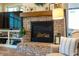 Living room with a beautiful brick fireplace and a view of the backyard at 2109 Meadowcreek Dr, Durham, NC 27705