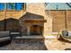 Custom brick fireplace in backyard with stone accents and comfortable seating area at 2109 Meadowcreek Dr, Durham, NC 27705