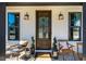 Elegant front door with glass panels, a welcoming wreath, and stylish exterior lighting fixtures at 2109 Meadowcreek Dr, Durham, NC 27705