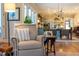Inviting living room with a comfortable armchair, seamlessly connected to the dining area and kitchen at 2109 Meadowcreek Dr, Durham, NC 27705