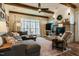Cozy living room with a brick fireplace, lots of natural light, and a view of the backyard at 2109 Meadowcreek Dr, Durham, NC 27705