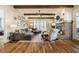 Spacious living room with wood beam ceilings, brick fireplace, and plenty of natural light at 2109 Meadowcreek Dr, Durham, NC 27705