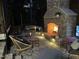 Outdoor patio with a brick fireplace and comfortable seating area, perfect for outdoor relaxation at 2109 Meadowcreek Dr, Durham, NC 27705