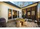 Charming outdoor dining area on a brick patio, perfect for entertaining guests at 2109 Meadowcreek Dr, Durham, NC 27705
