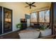 Inviting screened porch offers comfortable seating and natural light with forest views at 2109 Meadowcreek Dr, Durham, NC 27705