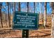 A riparian buffer sign reminding that the area is authorized by the City of Durham at 2109 Meadowcreek Dr, Durham, NC 27705