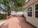 Expansive back deck features built-in seating and beautiful views of the landscaped backyard at 212 Walnut Creek Dr, Clayton, NC 27520