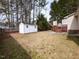 Large backyard with a shed, wood fence, and deck is perfect for outdoor activities and storage at 212 Walnut Creek Dr, Clayton, NC 27520