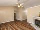Living room featuring stylish wood-look floors, fireplace, and ample natural light at 212 Walnut Creek Dr, Clayton, NC 27520