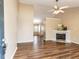 Inviting living room with fireplace, high ceiling, and stylish wood-look flooring at 212 Walnut Creek Dr, Clayton, NC 27520