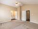Large main bedroom with vaulted ceilings, a ceiling fan, access to a bathroom with a double vanity and a large closet at 212 Walnut Creek Dr, Clayton, NC 27520