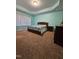 Bright bedroom with a large bed, bedside table, and large window at 2132 Royal Berry Ct, Cary, NC 27511