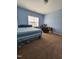 Bedroom with blue walls, carpet floors, bed, desk, and window at 2132 Royal Berry Ct, Cary, NC 27511
